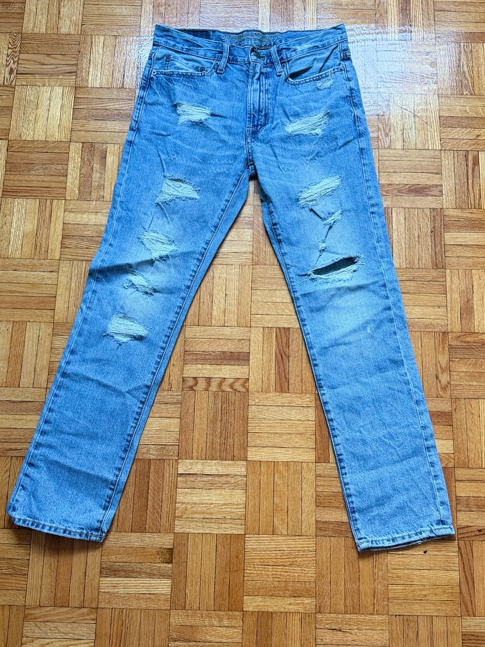 American Eagle Straight-Slim Blue Distressed Jeans with multiple ripped detail
